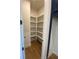Walk-in pantry offering ample shelving for storage, conveniently located near the kitchen at 115 Pinecone Pkwy, Alpharetta, GA 30022