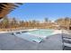 Relaxing community pool with in-water loungers and surrounding chairs at 115 Pinecone Pkwy, Alpharetta, GA 30022