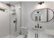 Modern bathroom features subway tile shower, matte black fixtures, and vanity at 174 Zelma Sw St, Marietta, GA 30060