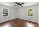 Bright bedroom with hardwood floors, ceiling fan, and two large windows offering plenty of natural light at 174 Zelma Sw St, Marietta, GA 30060