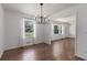 Bright dining room features hardwood floors, modern chandelier, and natural light at 174 Zelma Sw St, Marietta, GA 30060