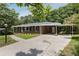 Lovely brick home with a convenient carport and well-maintained driveway, nestled in a serene, tree-filled neighborhood at 174 Zelma Sw St, Marietta, GA 30060