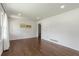Bright living room boasts pristine white walls, gleaming hardwood floors, and ample natural light, creating a welcoming space at 174 Zelma Sw St, Marietta, GA 30060