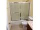 Bathroom features shower with glass door and sink at 386 Teal Ct, Roswell, GA 30076