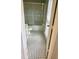 Bathroom features a shower over tub with black and white mosaic tile floor at 386 Teal Ct, Roswell, GA 30076