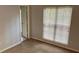 Bedroom featuring carpet flooring, a window, and an ensuite bathroom at 386 Teal Ct, Roswell, GA 30076