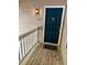 Classic navy blue front door with traditional hardware and a porch to enjoy the outdoors at 386 Teal Ct, Roswell, GA 30076