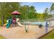 Community playground offers a safe and fun environment for with slides and play equipment at 386 Teal Ct, Roswell, GA 30076