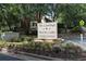 Entrance sign that reads: The Landings Martin Lakes Townhomes & Condominiums at 386 Teal Ct, Roswell, GA 30076