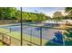 Community tennis courts with lake in background at 386 Teal Ct, Roswell, GA 30076