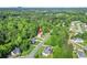 Aerial view of a neighborhood showcasing various homes and tree-lined streets at 4638 Arrow Wind Dr, Powder Springs, GA 30127