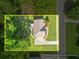 An aerial view showing the property's boundaries, driveway, and surrounding trees at 4638 Arrow Wind Dr, Powder Springs, GA 30127