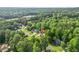 Aerial view of a home in a lush, green neighborhood at 4638 Arrow Wind Dr, Powder Springs, GA 30127