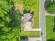 A bird's eye view of a charming home featuring a large lot, a long driveway, and lush green surroundings at 4638 Arrow Wind Dr, Powder Springs, GA 30127
