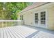 Back deck featuring a painted wood surface and double glass doors at 4638 Arrow Wind Dr, Powder Springs, GA 30127