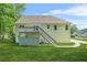 Back of house features a deck with stair access to a large yard at 4638 Arrow Wind Dr, Powder Springs, GA 30127