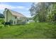 Expansive backyard with mature trees and ample space for outdoor activities at 4638 Arrow Wind Dr, Powder Springs, GA 30127