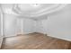 Spacious bedroom with tray ceiling, hardwood floors, and neutral paint at 4638 Arrow Wind Dr, Powder Springs, GA 30127