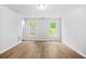 Empty bedroom with hardwood floors and a window at 4638 Arrow Wind Dr, Powder Springs, GA 30127