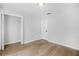 A bedroom with neutral paint, wood floor and closet featuring bi-fold doors at 4638 Arrow Wind Dr, Powder Springs, GA 30127