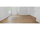 Bedroom with hardwood floors, neutral paint, and natural light at 4638 Arrow Wind Dr, Powder Springs, GA 30127