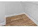 A walk-in closet is shown with built in metal shelving and hardwood floors at 4638 Arrow Wind Dr, Powder Springs, GA 30127