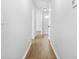 Bright hallway with wood-look flooring and neutral paint at 4638 Arrow Wind Dr, Powder Springs, GA 30127