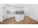 Bright kitchen with white cabinets, stainless steel appliances, and center island at 4638 Arrow Wind Dr, Powder Springs, GA 30127