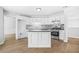 Well-lit kitchen with white cabinets, stainless steel appliances, and mosaic tile backsplash at 4638 Arrow Wind Dr, Powder Springs, GA 30127