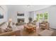 Comfortable living room with stone fireplace, plush seating, and abundant natural light at 4638 Arrow Wind Dr, Powder Springs, GA 30127
