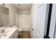 Practical bathroom featuring a vanity with sink, toilet, and a shower-tub combination at 771 Franklin Mill Trce, Loganville, GA 30052