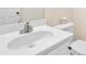 Clean bathroom features a white sink, vanity, and toilet at 771 Franklin Mill Trce, Loganville, GA 30052