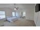 Spacious bedroom features vaulted ceilings, a ceiling fan and two large windows at 771 Franklin Mill Trce, Loganville, GA 30052