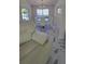 Elegant dining room features a glass table and ample natural light at 771 Franklin Mill Trce, Loganville, GA 30052