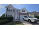 Two-story home features a brick facade, attached garage, and manicured lawn at 771 Franklin Mill Trce, Loganville, GA 30052
