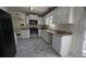 Well-equipped kitchen with white cabinets and stainless steel appliances at 771 Franklin Mill Trce, Loganville, GA 30052