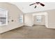 Bright main bedroom features neutral walls, carpeted floor, a vaulted ceiling and multiple windows at 771 Franklin Mill Trce, Loganville, GA 30052