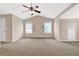 Bright main bedroom features neutral walls, carpeted floor, a vaulted ceiling and multiple windows at 771 Franklin Mill Trce, Loganville, GA 30052