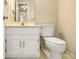 Cozy bathroom with a white vanity, toilet, and neutral-toned tile flooring at 1505 September Chase, Decatur, GA 30033