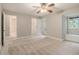 Neutral bedroom with large window, built-in bench, and connected bathroom at 1505 September Chase, Decatur, GA 30033