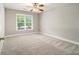 Bright bedroom with neutral walls, plush carpet and large window providing ample natural light at 1505 September Chase, Decatur, GA 30033