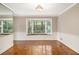 Bright dining area featuring hardwood floors and a large bay window offering serene outdoor views at 1505 September Chase, Decatur, GA 30033