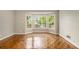 Dining area with bay windows offering beautiful natural light and warm hardwood floors at 1505 September Chase, Decatur, GA 30033