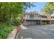 Beautiful brick home featuring meticulous landscaping, lush trees and a charming walkway at 1505 September Chase, Decatur, GA 30033