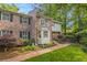Charming townhome featuring brick and siding, a bay window, and mature landscaping at 1505 September Chase, Decatur, GA 30033