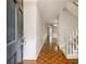 Inviting foyer with hardwood floors, staircase, and neutral paint, leads into the home at 1505 September Chase, Decatur, GA 30033