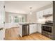 Bright, remodeled kitchen featuring white cabinets, granite countertops, and stainless steel appliances at 1505 September Chase, Decatur, GA 30033