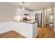 Modern kitchen with white cabinets, granite countertops, stainless steel appliances, and wood floors at 1505 September Chase, Decatur, GA 30033