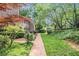 Landscaped brick walkway leading to the side of the townhome in a beautiful garden setting at 1505 September Chase, Decatur, GA 30033