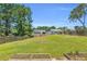 Large backyard with lush grass, fenced for privacy, and space for gardening at 3327 James Harbor Way, Lawrenceville, GA 30044